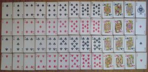 A new pristine deck of playing cards ordered by rank-and-suit precisely
