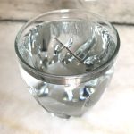 Floating metallic needle in water